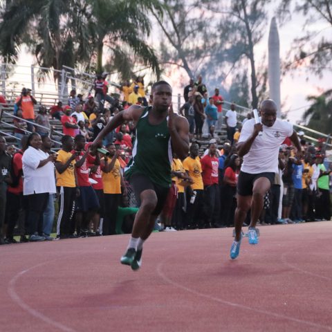 Marine Seaman Delmaro Bullard running the first leg of the 4 x 100 meter relay at the Police Track Meet on April 4, 2018 at the Thomas A. Robinson Stadium. The Royal Bahamas Defence Force men placed second in that event.