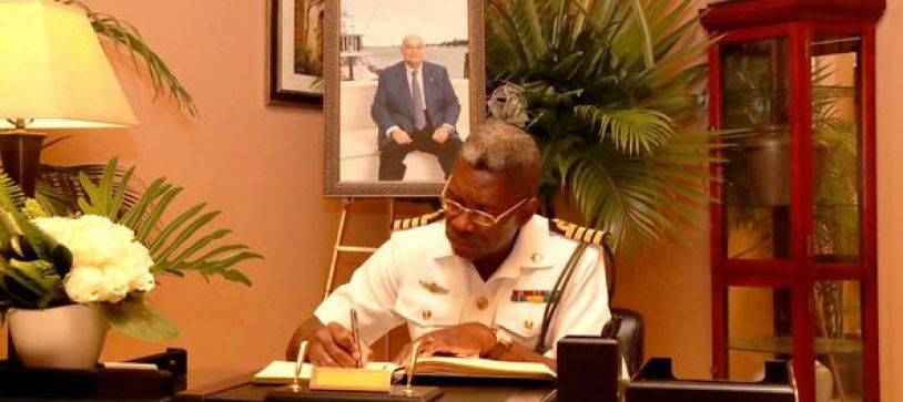 DEPUTY COMMANDER DEFENCE FORCE SIGNS BOOK OF CONDOLENCES FOR THE LATE GEORGE MYERS
