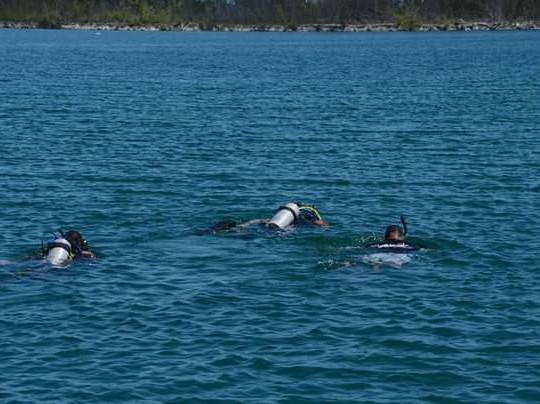 DEFENCE FORCE DIVERS FIND BODY IN SUBMERGED VEHICLE IN SEABREEZE CANAL