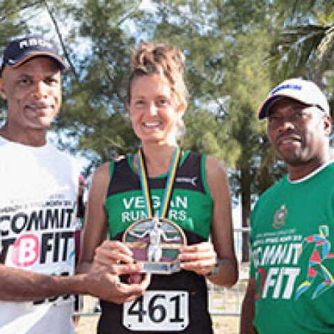Roberta Fontana receiving his award as the top female runner at the RBDF Fun Run/Walk and Health expo on April 14, 2018 also shown are: RBDF Commodore Tellis Bethel and Training Officer Lieutenant Origin Deleveaux Jr.