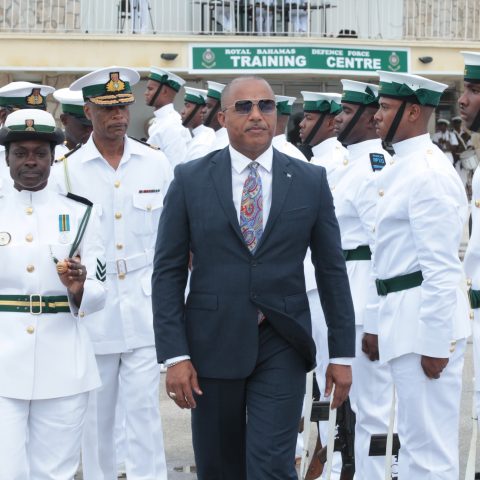 Minister of National Security Hon. Marvin Dames, Commander Defence Force Tellis Bethel with RBDF officers conducting parade inspection.