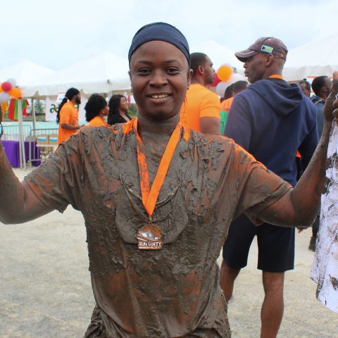 Leading Woman Marine Lashanna Williams showing her enthusiasm after completing the Bahama Health Mud Run 2018.