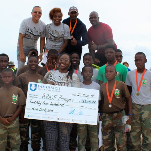 RBDF Rangers being presented with a cheque from the Bahamas Health Foundation.