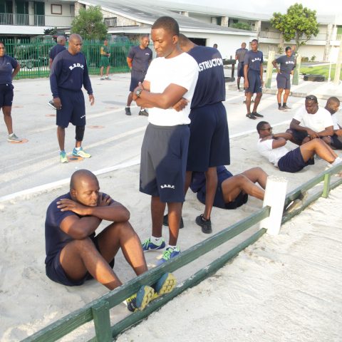 RBDF Personnel participating in the sit-up exercise during the annual Base Fitness Test at the Defence Force Base.