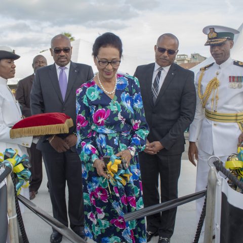 Governor General Her Excellency The Most Honourable Dame Marguerite Pindling performing the traditional cutting of the ribbon during the official Commissioning ceremony for the Royal Bahamas Defence Force patrol craft, HMBS MADEIRA on November 28, 2018. Also shown are: Prime Minister The Most Honorable Dr. Hubert Minnis; Minister of National Security, the Honourable Marvin Dames; Commodore Tellis Bethel, Commander Defence Force and Petty Officer Marguerite Taylor.