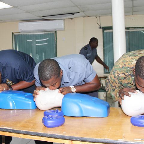 Course Participants performing CPR in a simulation exercise during the American Heart Association First Aid and CPR Training at the Coral Harbour Base.