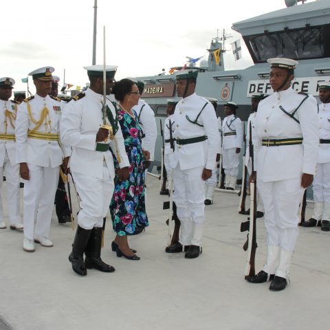 Guard Commander Sub Lieutenant Delroy Dennis escorting the Governor General Her Excellency The Most Honourable Dame Marguerite Pindling during the inspection of the Royal Guard during the official Commissioning ceremony for the Royal Bahamas Defence Force patrol craft, HMBS MADEIRA on November 28, 2018. Also shown are: Commodore Tellis Bethel, Commander Defence Force and Lieutenant Delvonne Duncombe, Aide-de-Camp, Commander Defence Force.