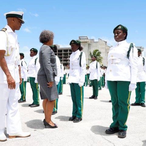 Deputy Permanent Secretary at the Ministry of National Security, Ms. Lisa Adderley inspecting the Rangers Guard during the Passing Out Parade Ceremony at the Defence Force’s Coral Harbour Base on May 25th. Also shown are Commander Defence Force Commodore Tellis Bethel and Command Force Chief Oral Wood.