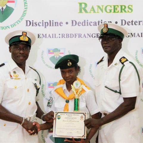 Kyiarjah Roker from St. George’s High School. She received the overall Minister of National Security Award at the RBDF Rangers Passing out Parade ceremony in Grand Bahama on May 11, 2019. Also shown are: Lieutenant Commander Johnson, the commanding officer of the RBDF Freeport Base and Rangers Operations Senior Rate, Chief Petty Officer Pedro Bain.